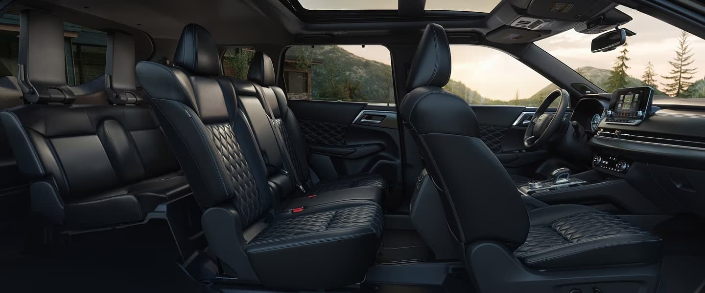 Nissan Rogue rear interior, woman puts bags
